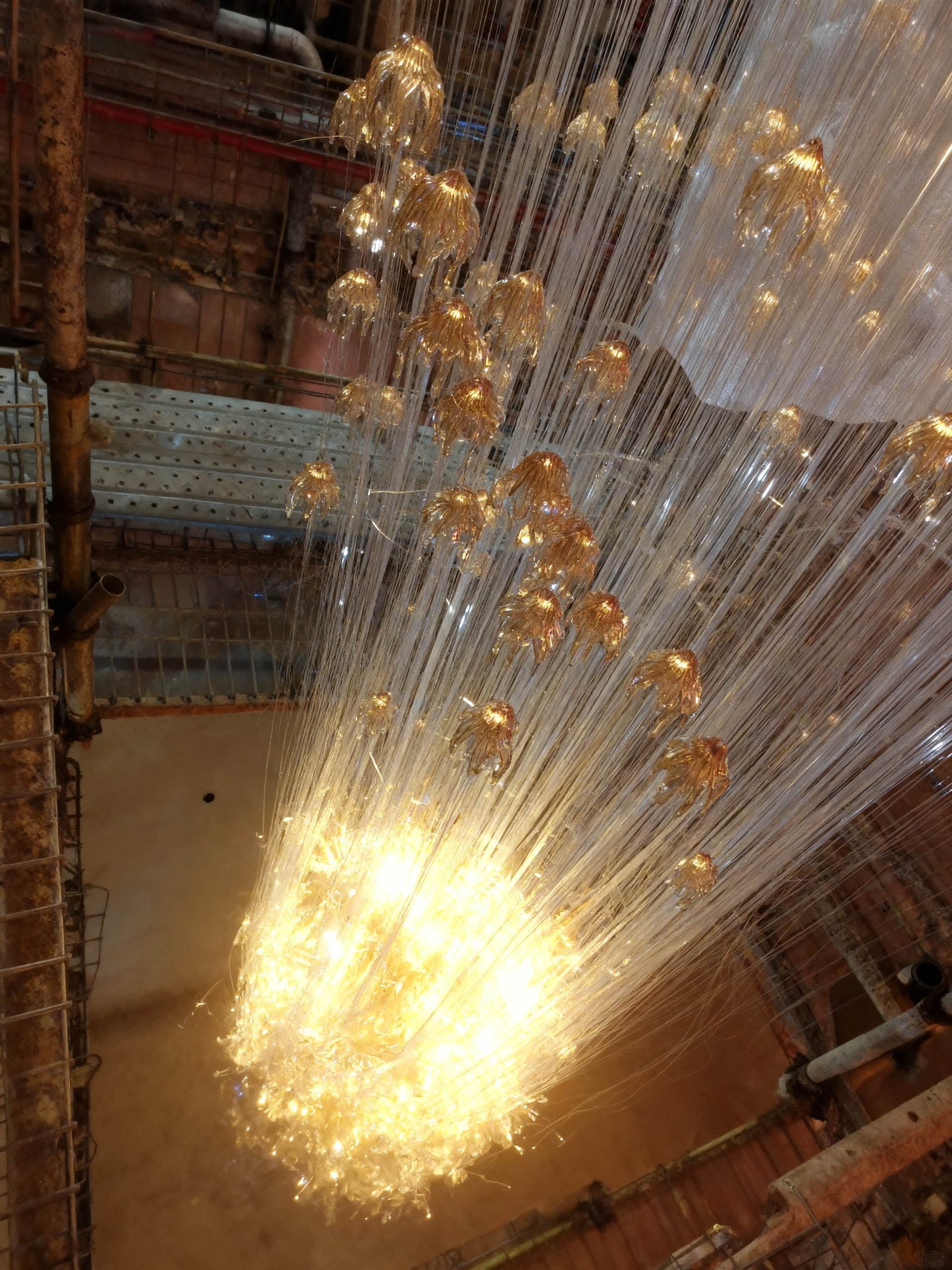 RAINFALL lit in a hotel lobby, wide interior view