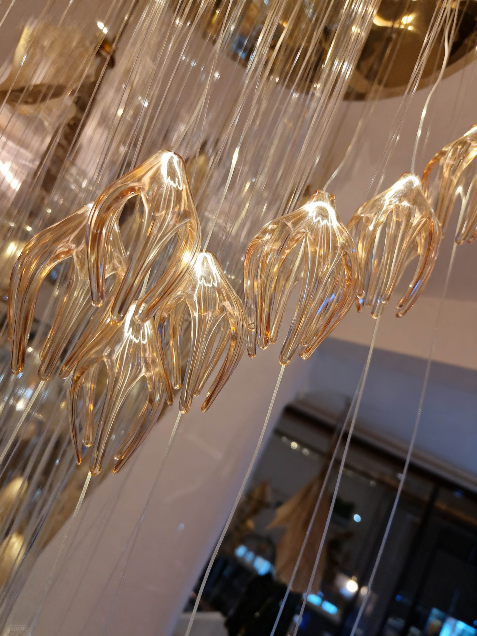 RAINFALL ceiling installation lit in the evening