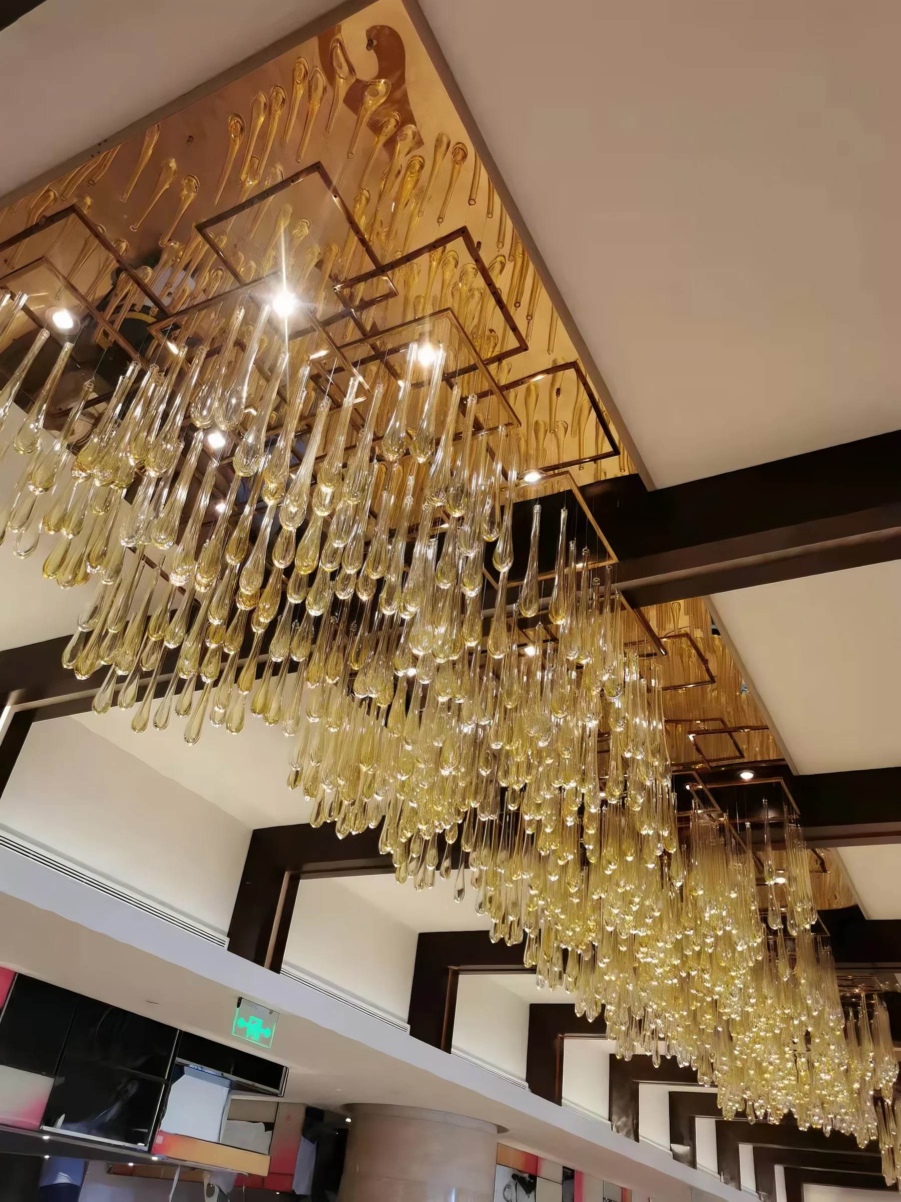 DEWDROP ceiling installation, close detail of the glass + stainless steel