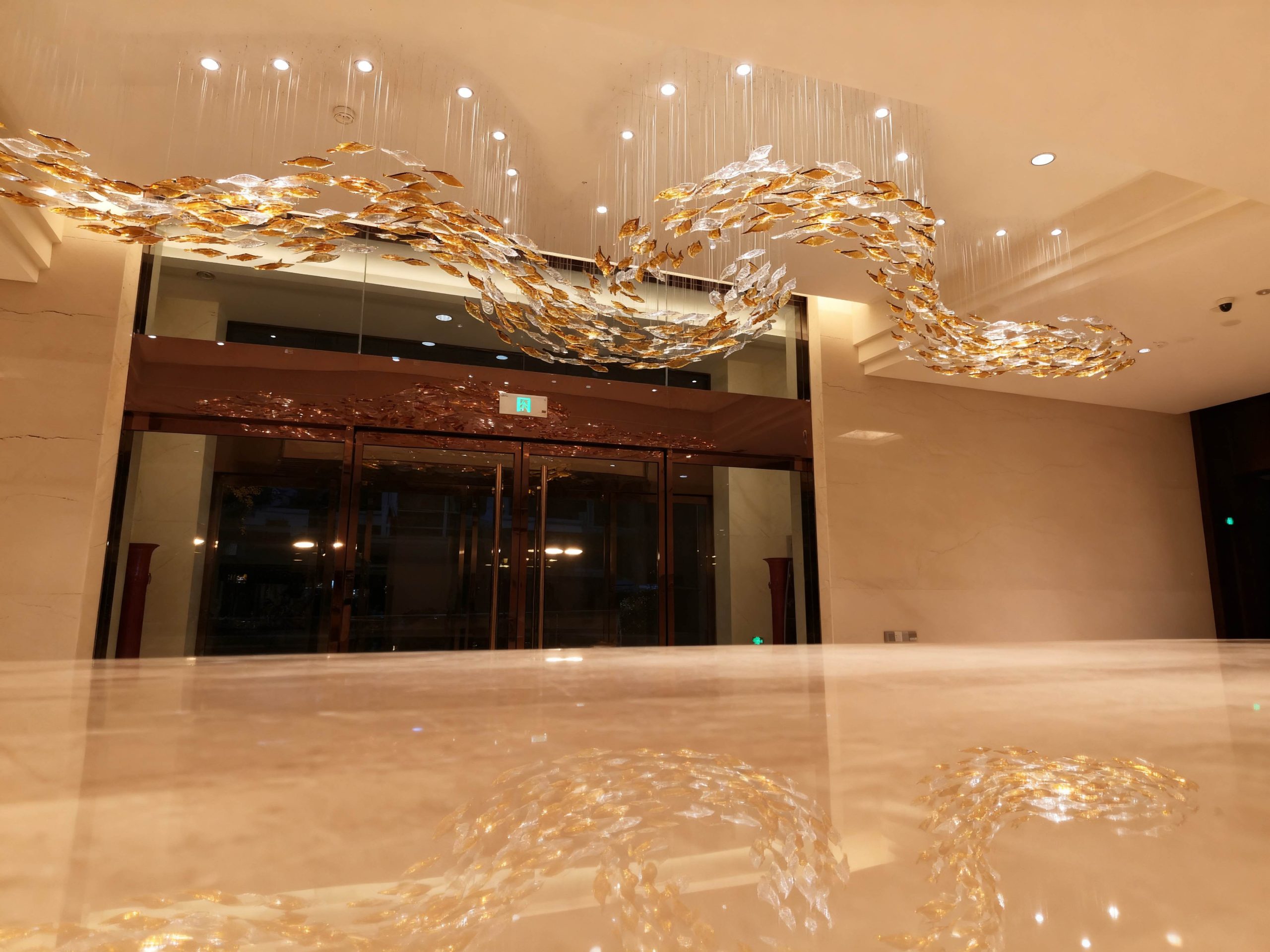 PISCES custom glass installation by SHUCHUANG, full view in a hotel lobby