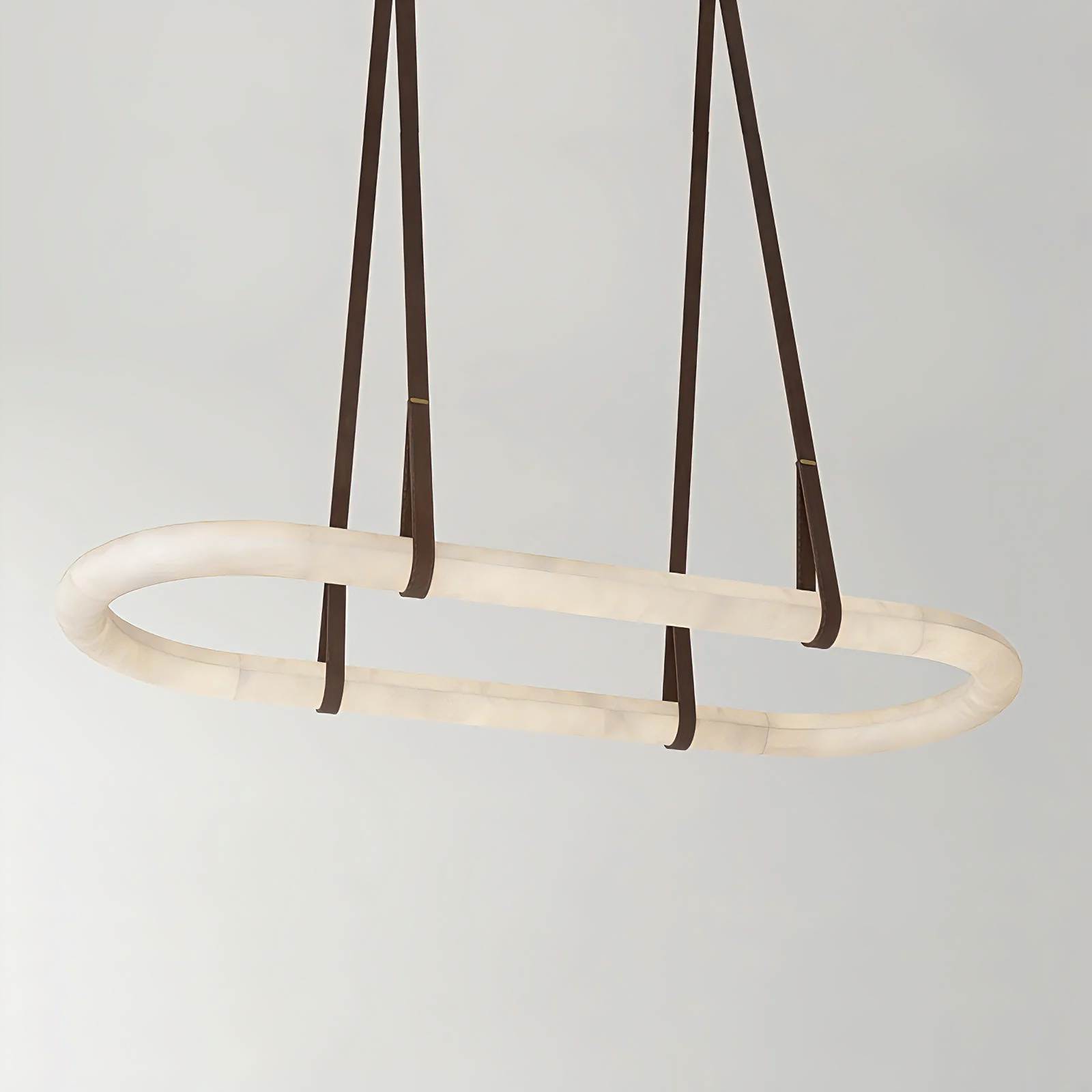 MILAN alabaster pendant light hanging over a dining table