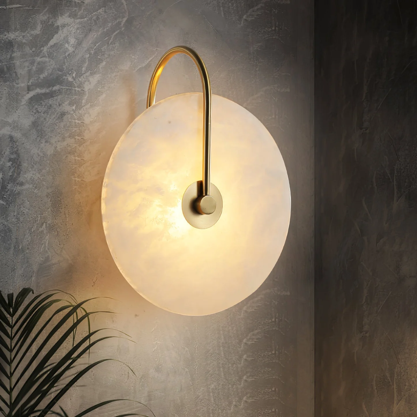 LUCIANA alabaster pendant light hanging over a dining table