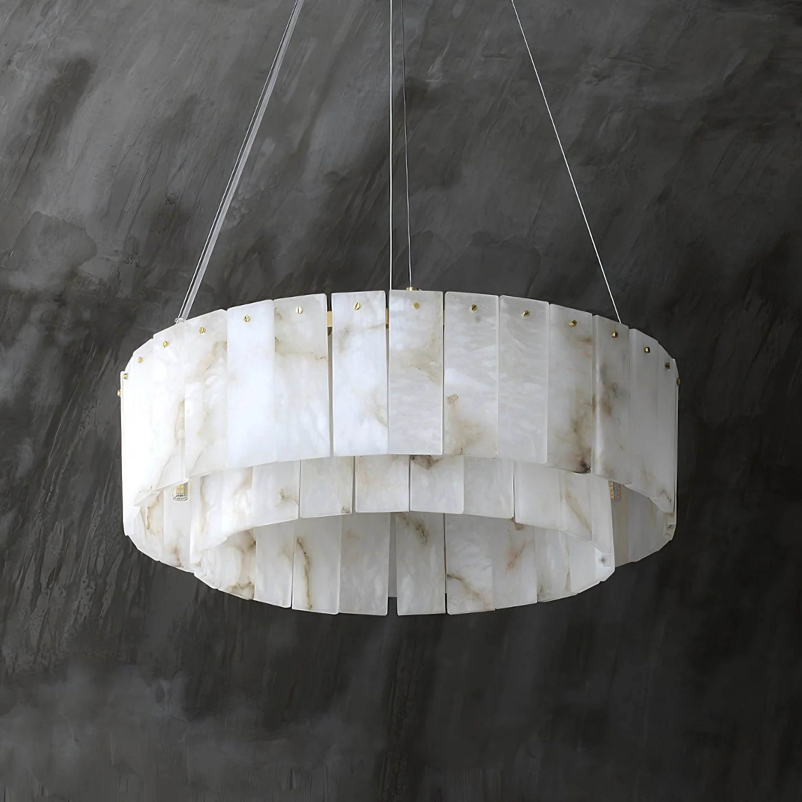 PALAZZO alabaster pendant light hanging over a dining table