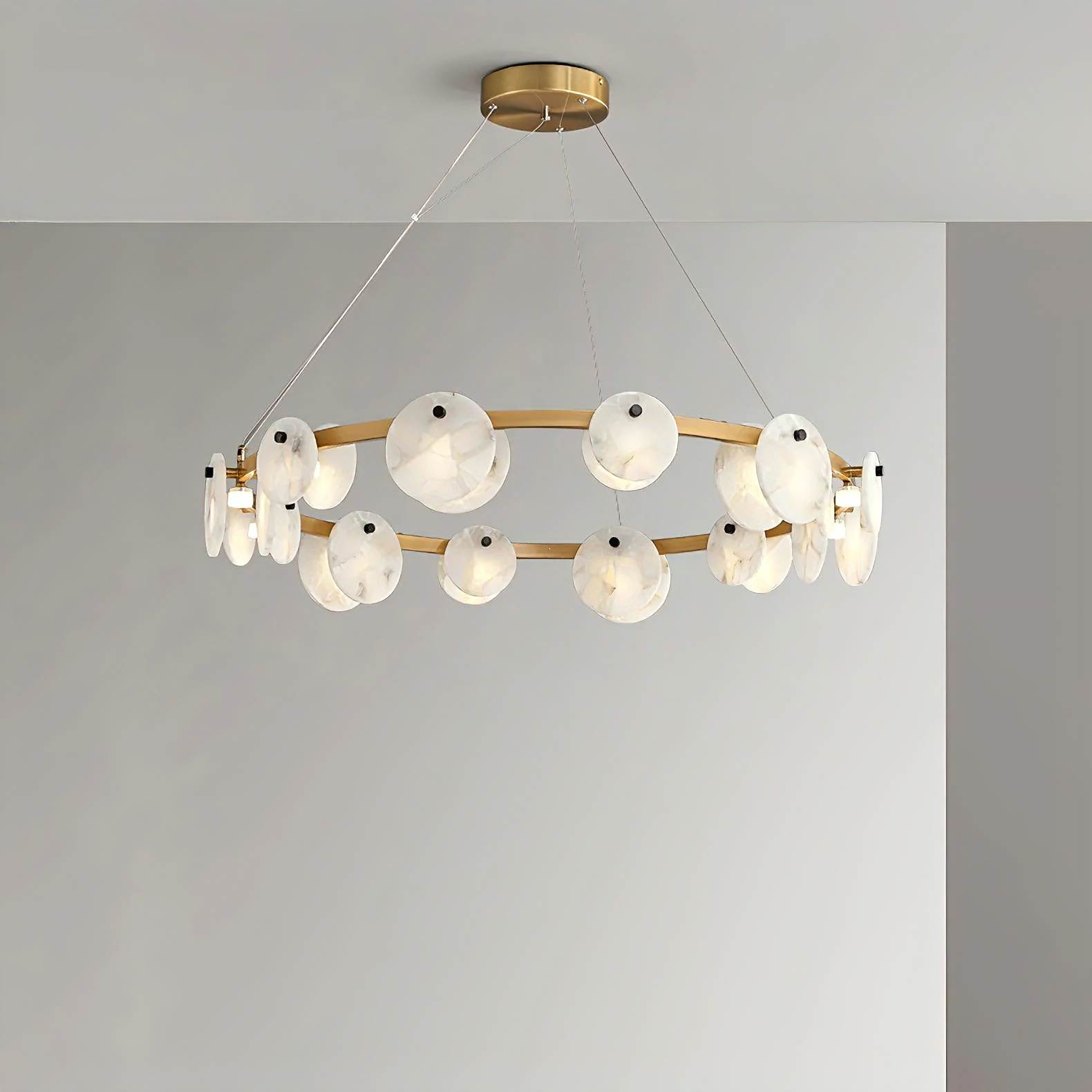 ORION alabaster pendant light lit in a living room