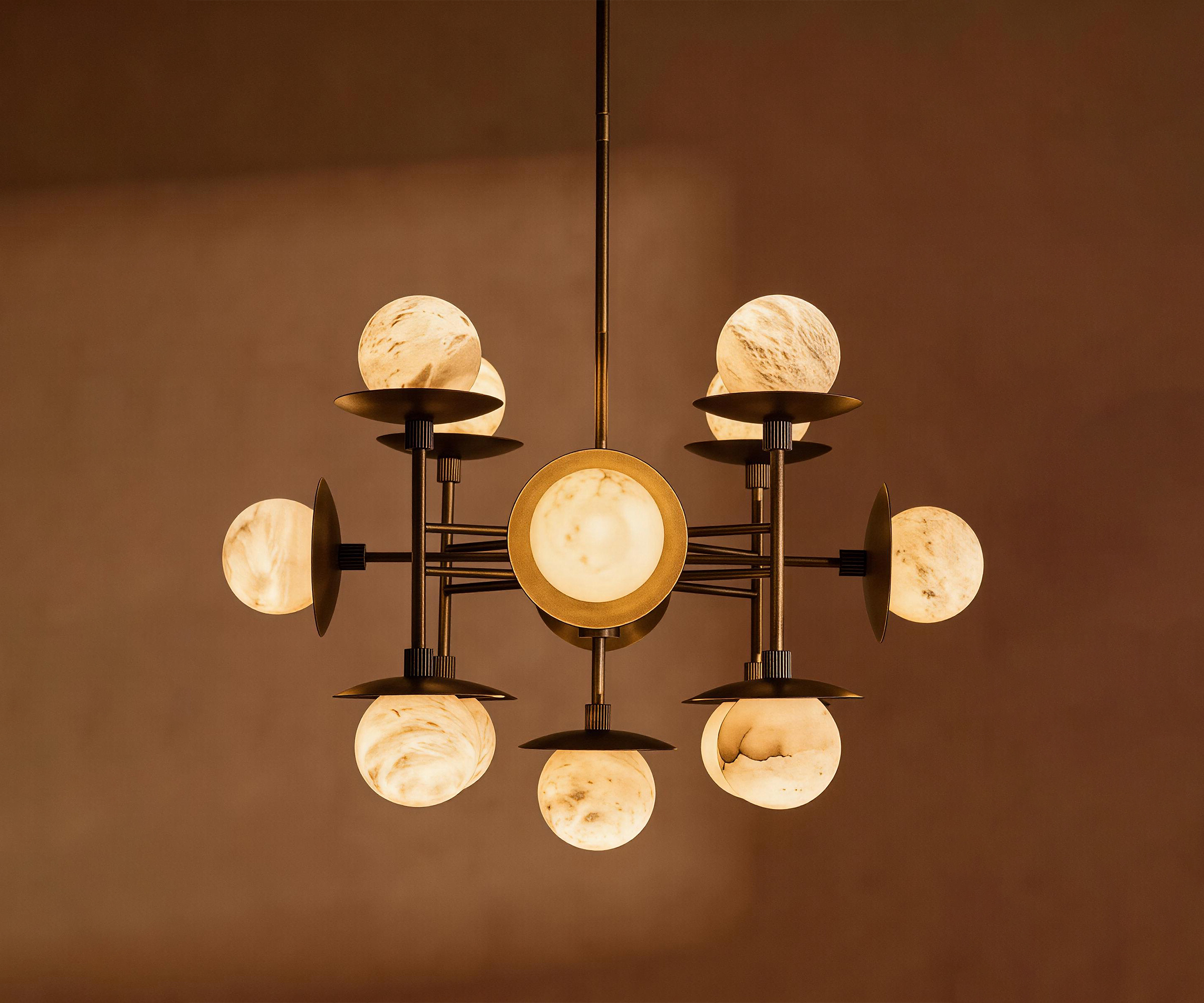 ARGO alabaster pendant light lit in a living room