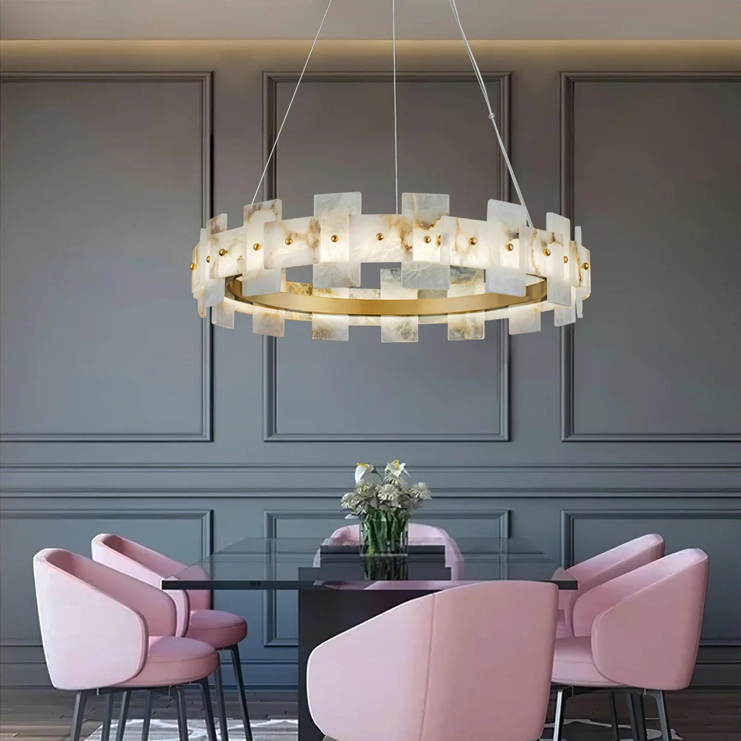 CALEB alabaster pendant light hanging over a dining table