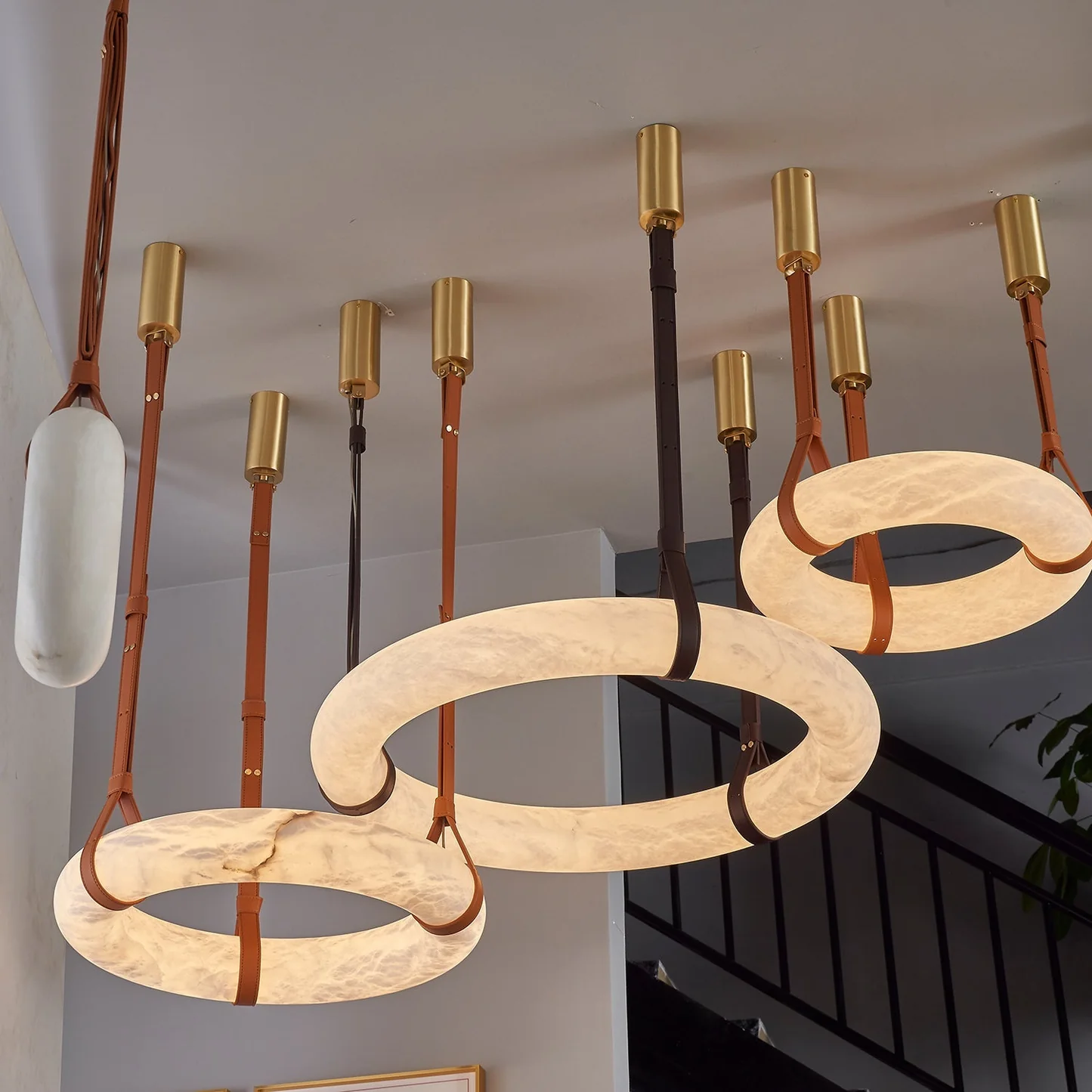 LAREDO alabaster Pendant light lit in a living room