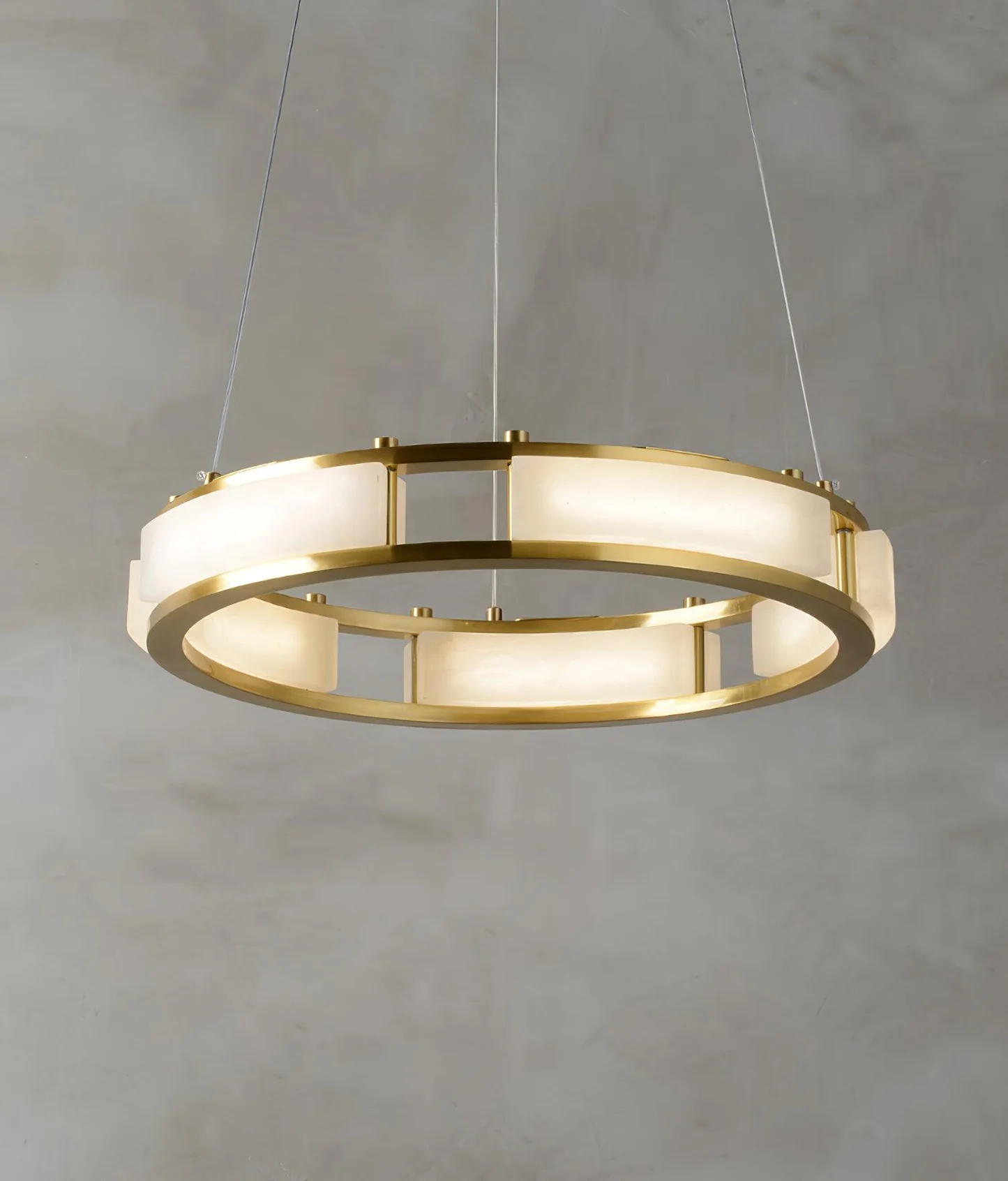 HARLOW alabaster Chandelier hanging over a dining table