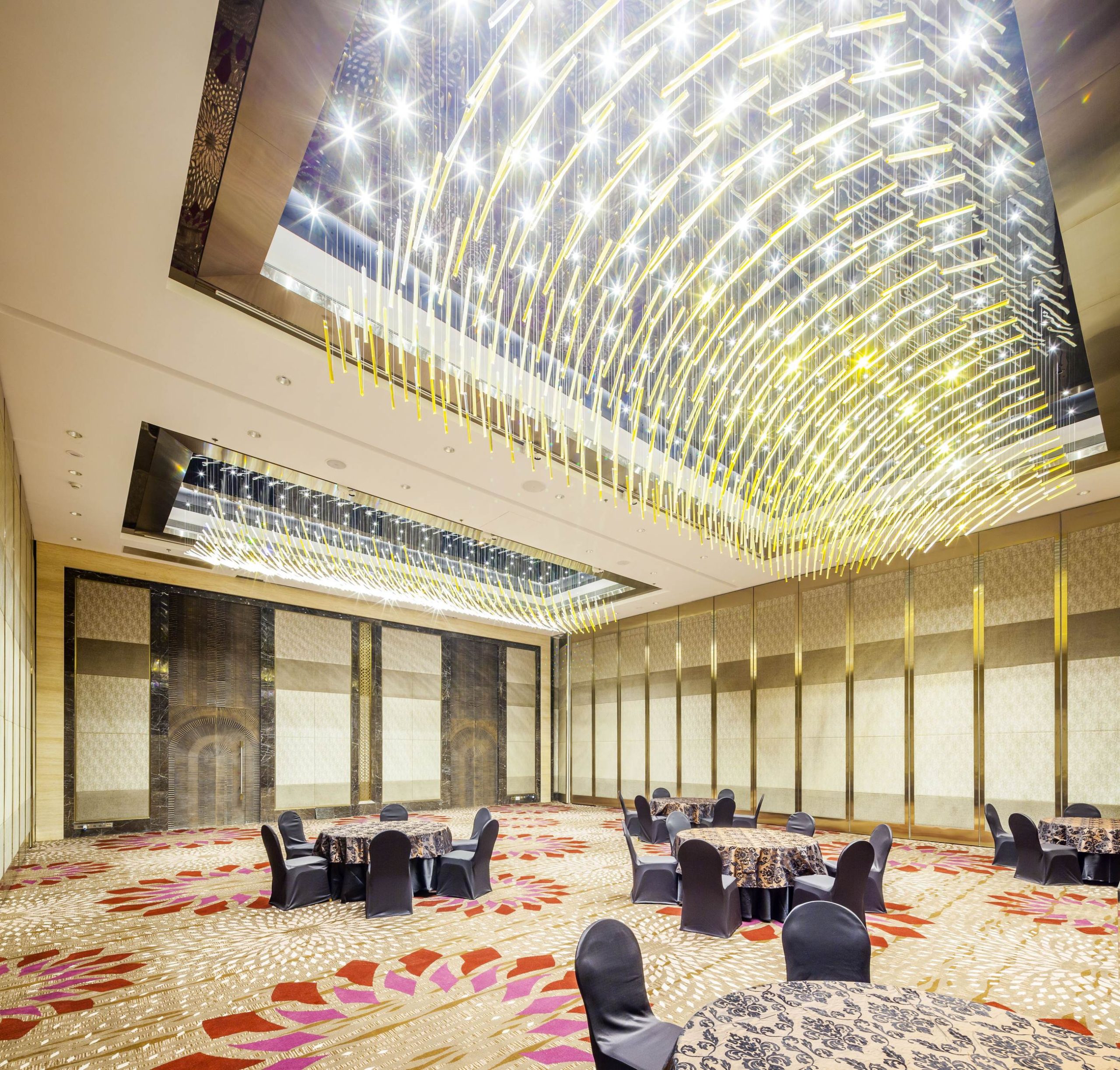 Detail of bespoke glass lighting installation in a hotel lobby