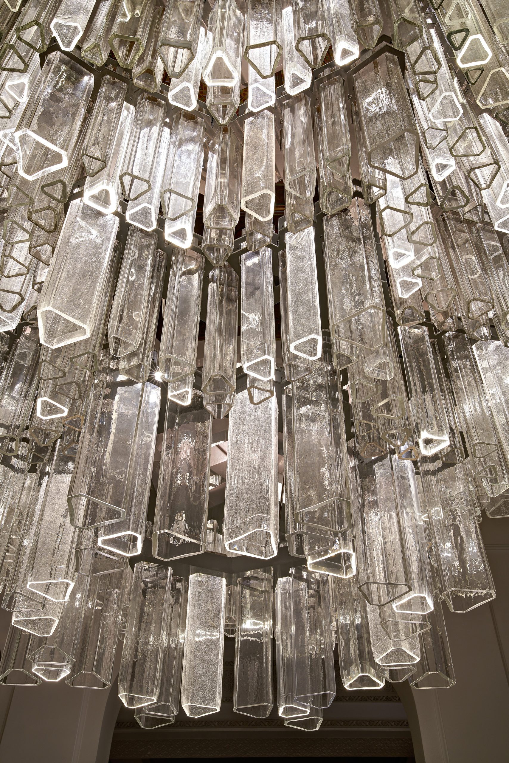 PRISM glass tube chandelier seen from the salon floor
